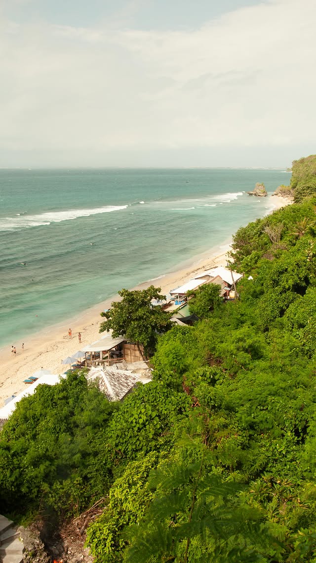 Aerial view of Thomas Beach framed by limestone cliffs and jungle