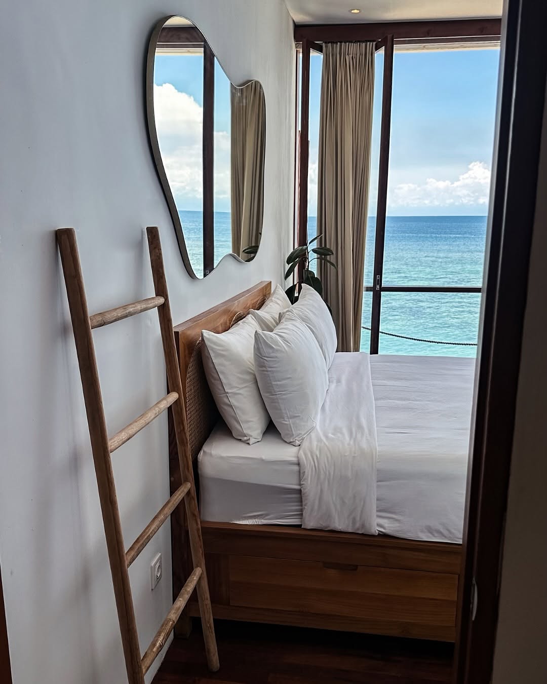 Ohm room with ocean-view balcony and wooden ladder